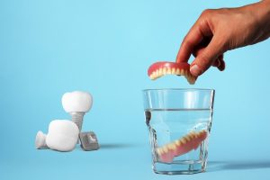 What are the Differences Between Implants and Removable Dentures?